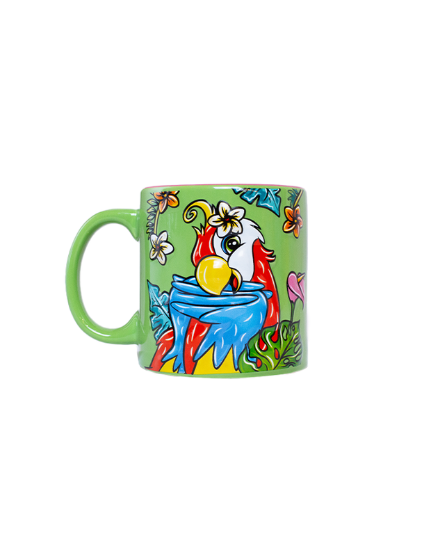 A colorful green mug with a posing parrot surrounded by tropical flowers and leaves. 