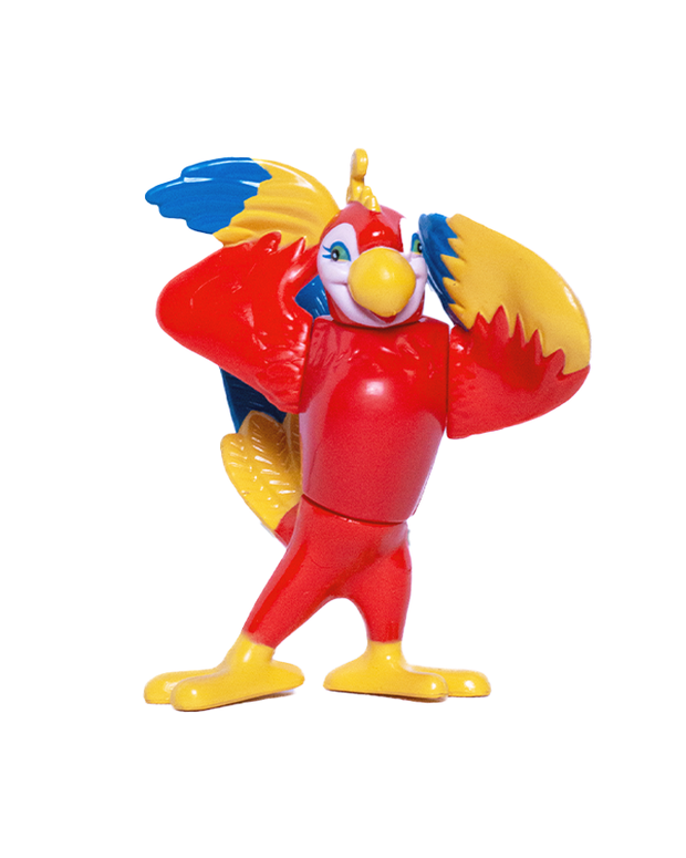 A colorful toy figure of a bird with playful and exaggerated features, primarily red with yellow feet and blue wings spread wide. It has large white eyes with black pupils and a multicolored beak that is partly open, adding to its whimsical expression. The bird stands in a dynamic pose, as if caught mid-dance or play, against a plain white background.