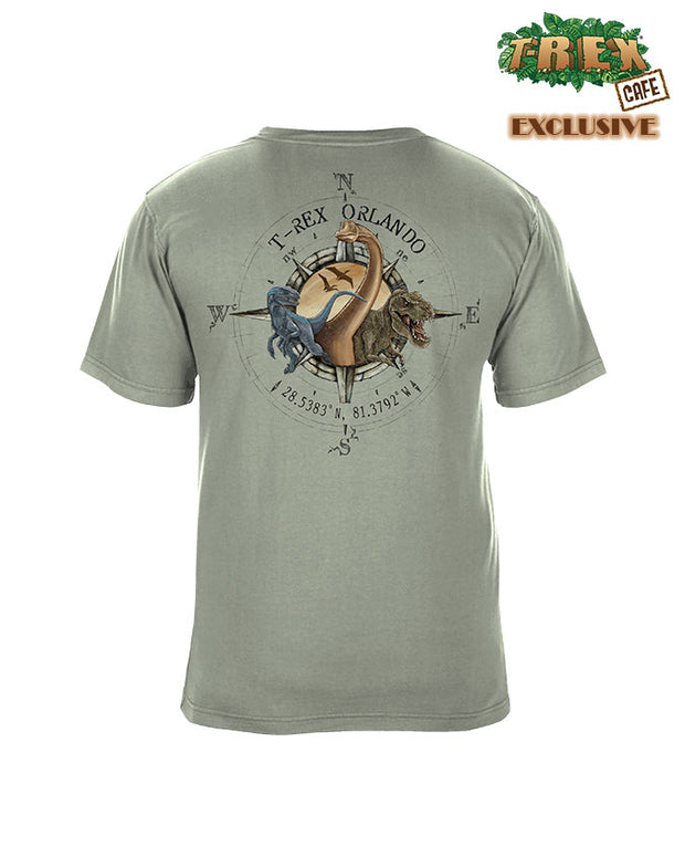 Green shirt with compass design on back and dinousaurs coming out of center.