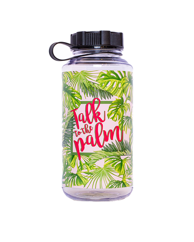 A clear water bottle with a black lid, featuring a tropical design with green palm leaves and the playful phrase ‘Talk to the palm’ in red text, set against a white background.