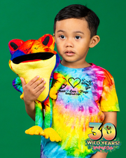 boy model wearing tie dye "Rainforest Cafe Peace, Love & Frogs" tee while holding tie dye cha cha plush.