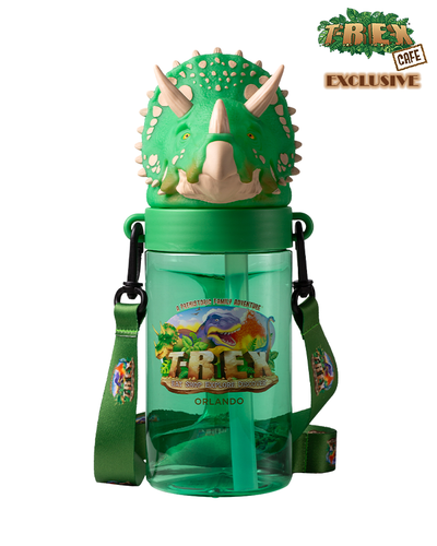 A green, dinosaur-themed water bottle with a 3D triceratops head lid, labeled ‘T-REX CAFE EXCLUSIVE’ and featuring an image of a colorful T-Rex and the text ‘A PREHISTORIC FAMILY ADVENTURE - T-REX - EAT, SHOP, EXPLORE & DISCOVER - ORLANDO’.