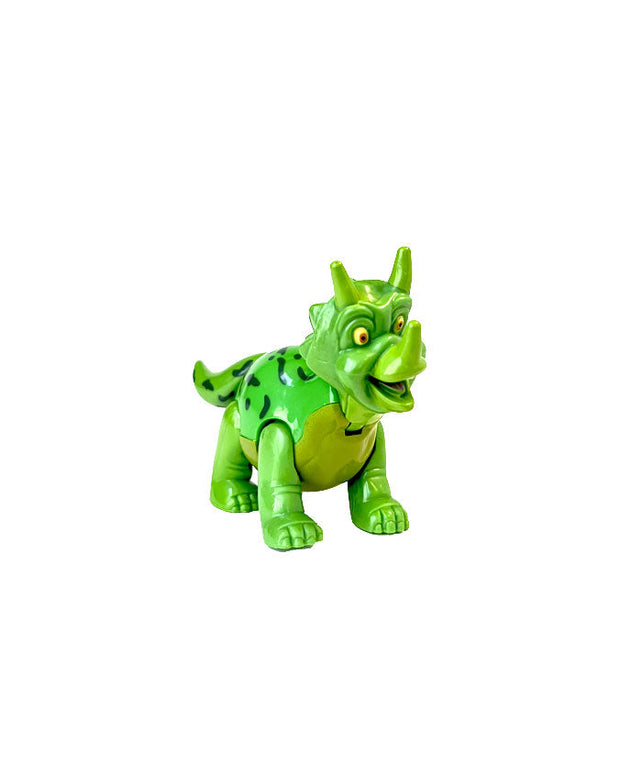 Green Trixie the Triceratops figurine posed in front of white background.