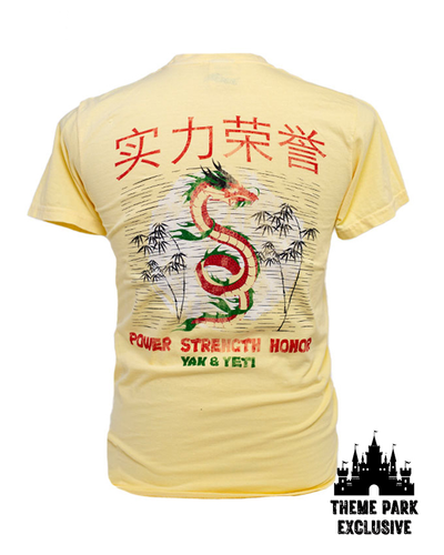 Light yellow back of shirt with a red and green dragon in the middle and words "Power, Strength, Honor" in Chinese and English and black "Theme Park Exclusive" tags in corners.