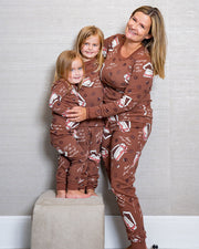 Mother hugging her two daughters while wearing the Box of Chocolates pajama sets.