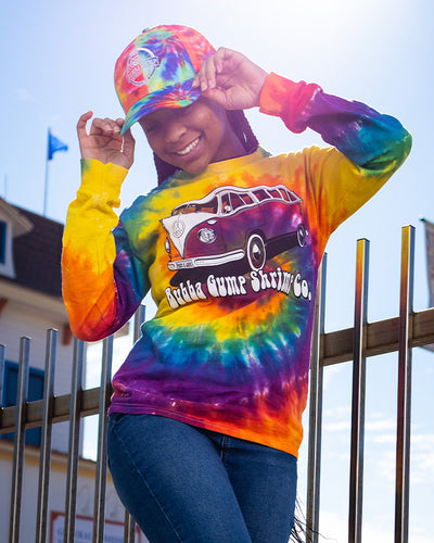 Young girl wearing Groovy VW van long sleeve tee with Bubba Gump tie dye logo cap.