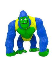 A colorful PVC figurine of Bamba the Gorilla, featuring bright blue fur, green skin, and a yellow vest. The gorilla’s friendly expression and dynamic pose suggest it’s ready for an adventure at the Rainforest Cafe