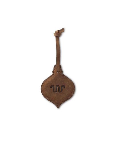 Brown leather ornament with King Ranch logo in center.