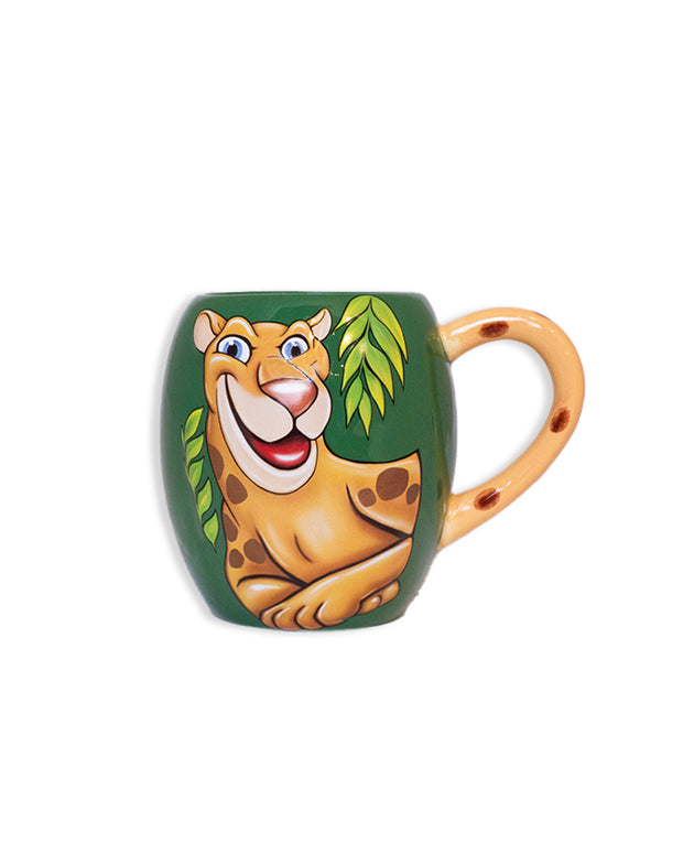 Ceramic green coffee mug with a smiling Maya painted in the center and a jaguar-print handle.