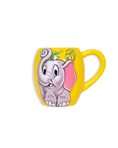 Ceramic yellow coffee mug with a smiling Tuki the Elephant painted in the center.