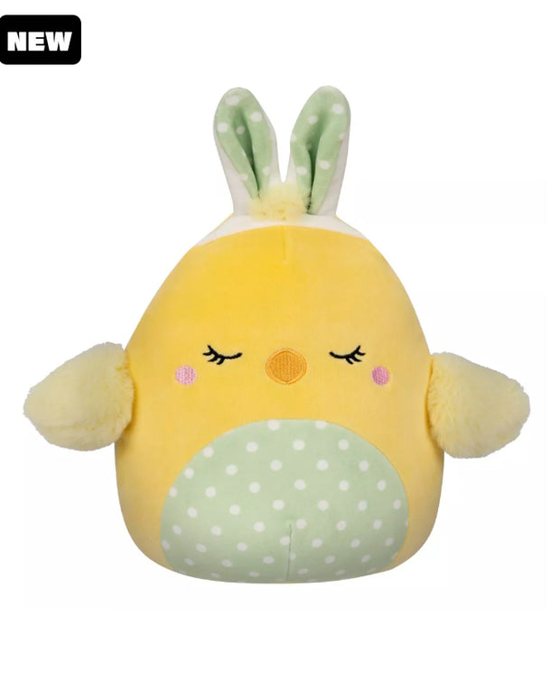 Yellow chick Squishmallow with wings, a polka dot stomach, closed eyes, green polka dot bunny ears, and a black "New" tag in top corner.