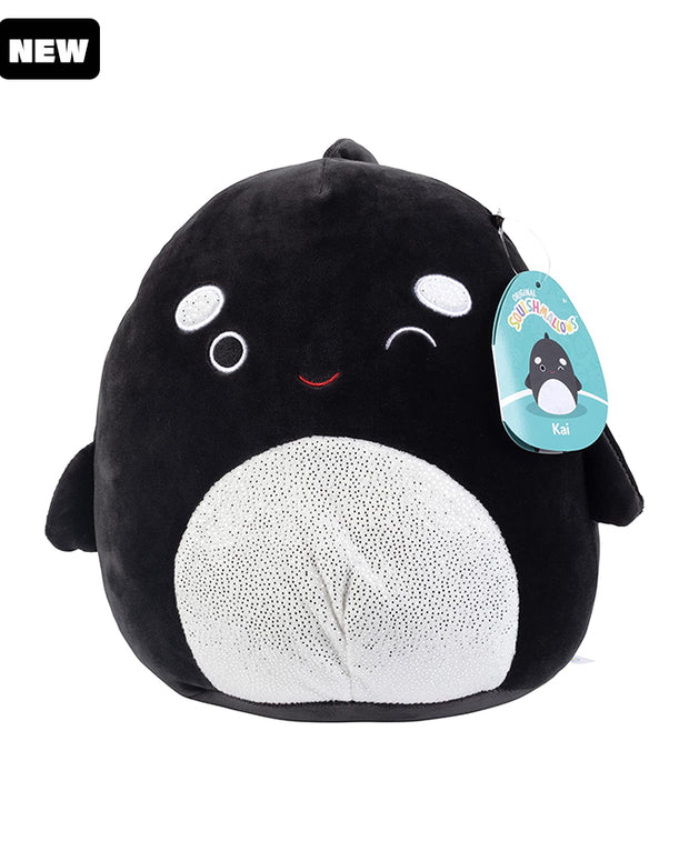 Black and white Squishmallow with a winking face, white glittery stomach and eyebrows, fins, top fin, and black "New" label in top corner.