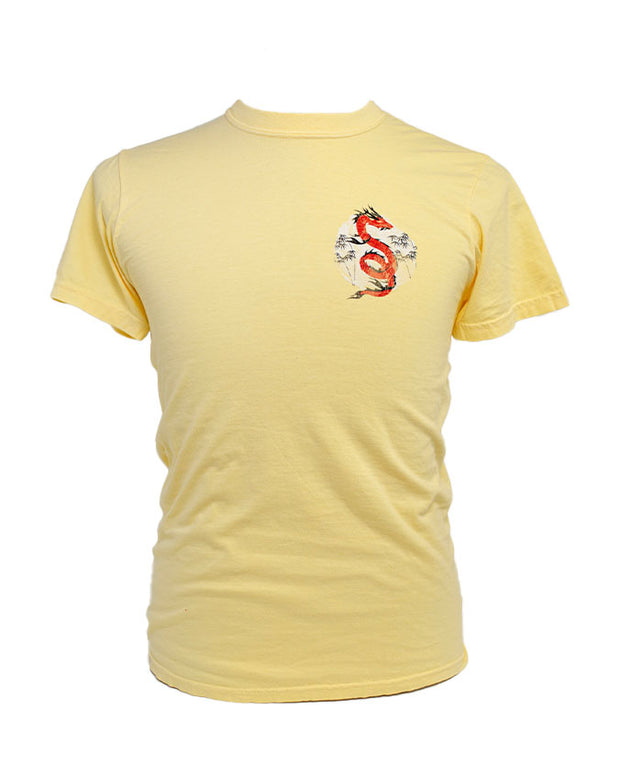 Front of tee with red dragon in front of white tree background on left chest of shirt.