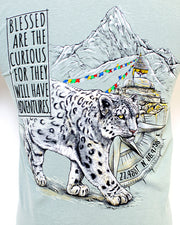 Close up of design on back with snow leopard walking through arctic town and wording saying "Blessed Are The Curious, For They Will Have Adventures"
