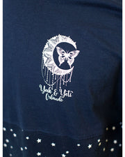 Close up look of Yak & Yeti branding that is a sparkling cresent moon with a butterfly in between two points.
