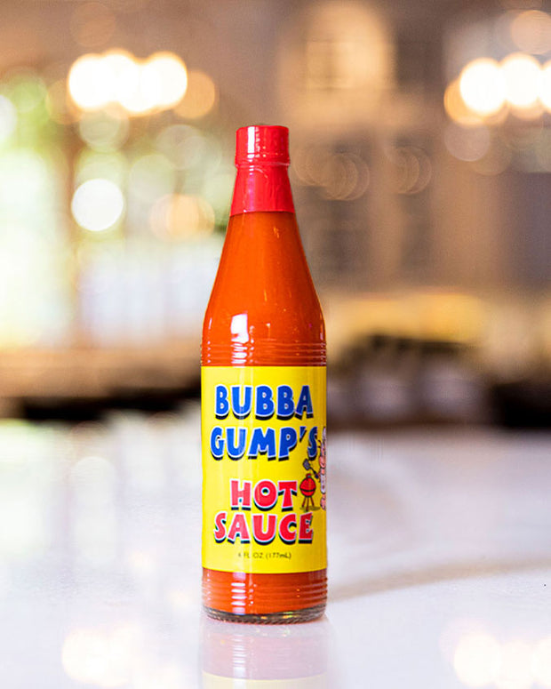 Bubba Gump's Hot Sauce placed on top of table with background blurred.