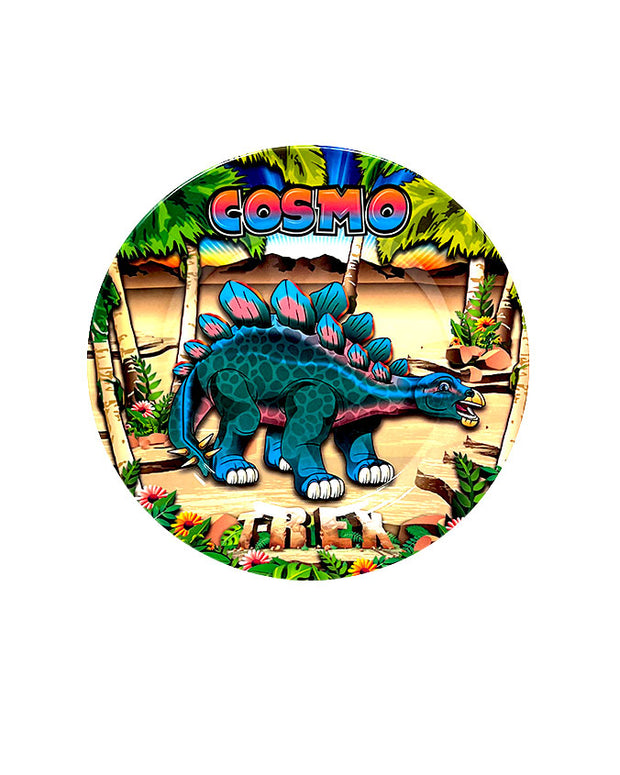 Vibrant-colored Cosmo the Stegosaurus in front of a palm tree beach background on plate.