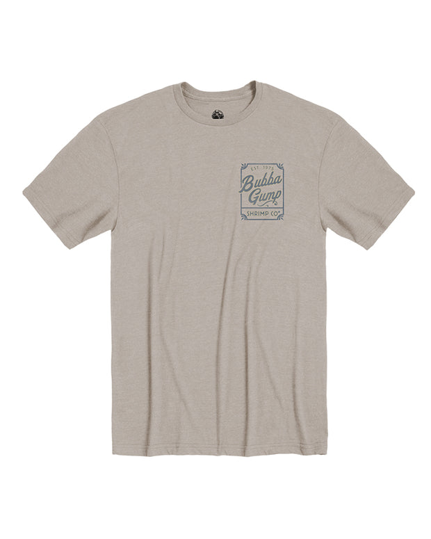 The front of the beige crew neck short sleeve tee with left chest graphic. The graphic is small and rectangular with Bubba Gump Shrimp Co. wording and the year 1975.