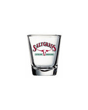 Saltgrass logo decal shot glass in front of white background.