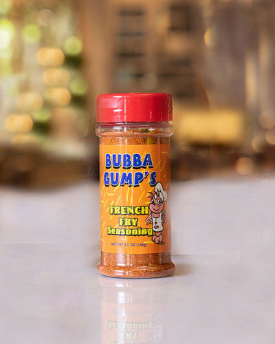 Bubba Gump's French Fry Seasoning placed on top of table with background blurred.