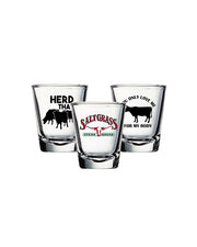 3 shot glasses; one with Saltgrass logo, one with "Herd That" with cow herd decal, and one with "You Only Love Me For My Body" with cow decal.