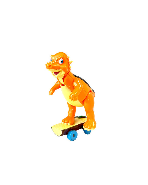 Side view of Sly the Pachycephalosaurus riding a skateboard figurine. 