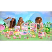 Group of 3 girls playing with entire Squishville by Squishmallows collection in front of a childlike nature background.