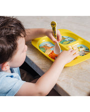 Toddler eating at the table using the Yellow Kids Divided Plate with matching spoon.